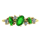 Top view of the 18ct yellow gold Atlantis Paradise ring featuring a vibrant green tsavorite garnet and an asymmetrical diamond cluster.