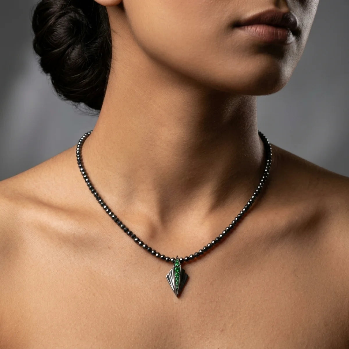 Silver Art Deco tsavorite garnet and hematite necklace worn on model showing length and scale