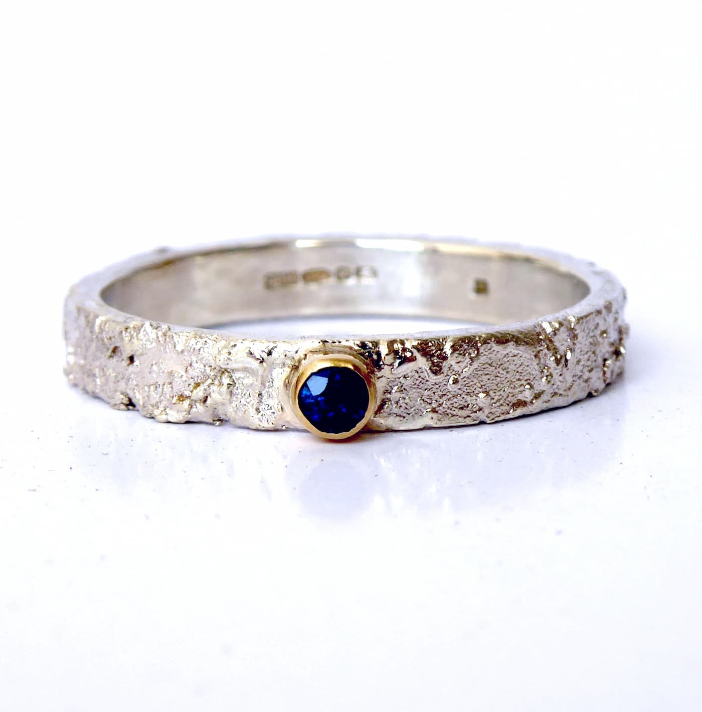 Rivda blue sapphire handmade textured silver ring with gold setting