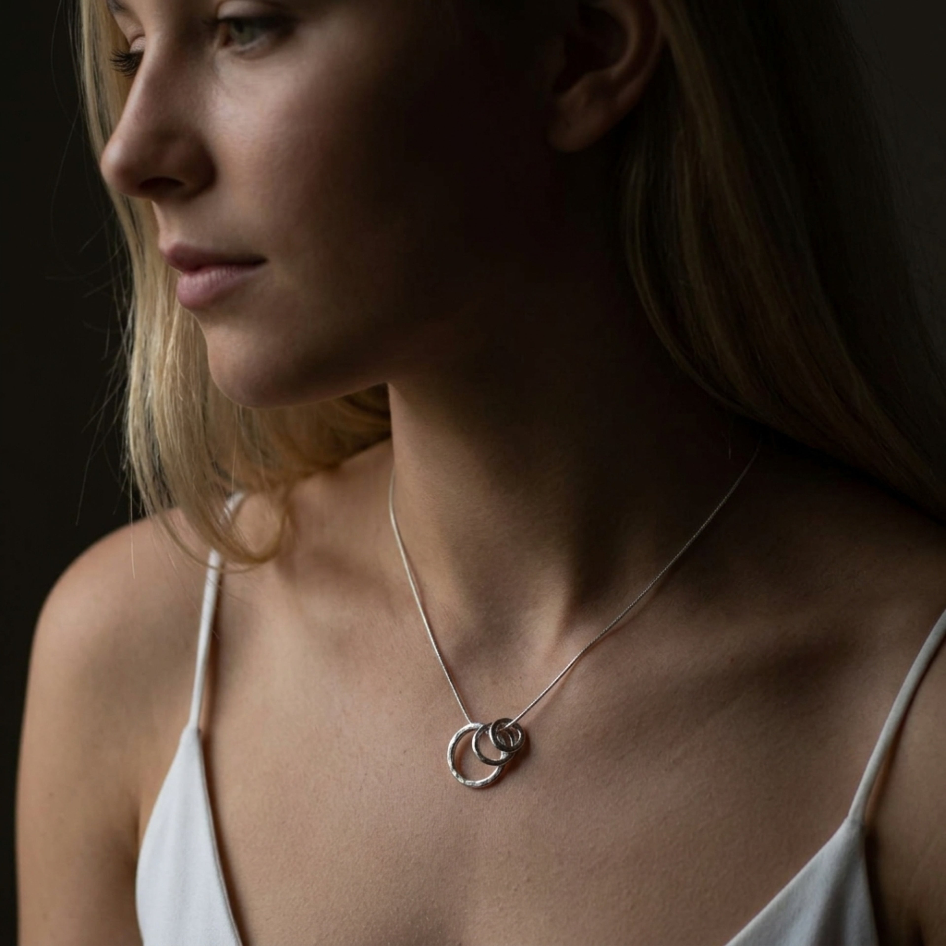 Front view of the Vanilla Links Tri-Pendant in sterling silver featuring three interlocking graduated concave discs.