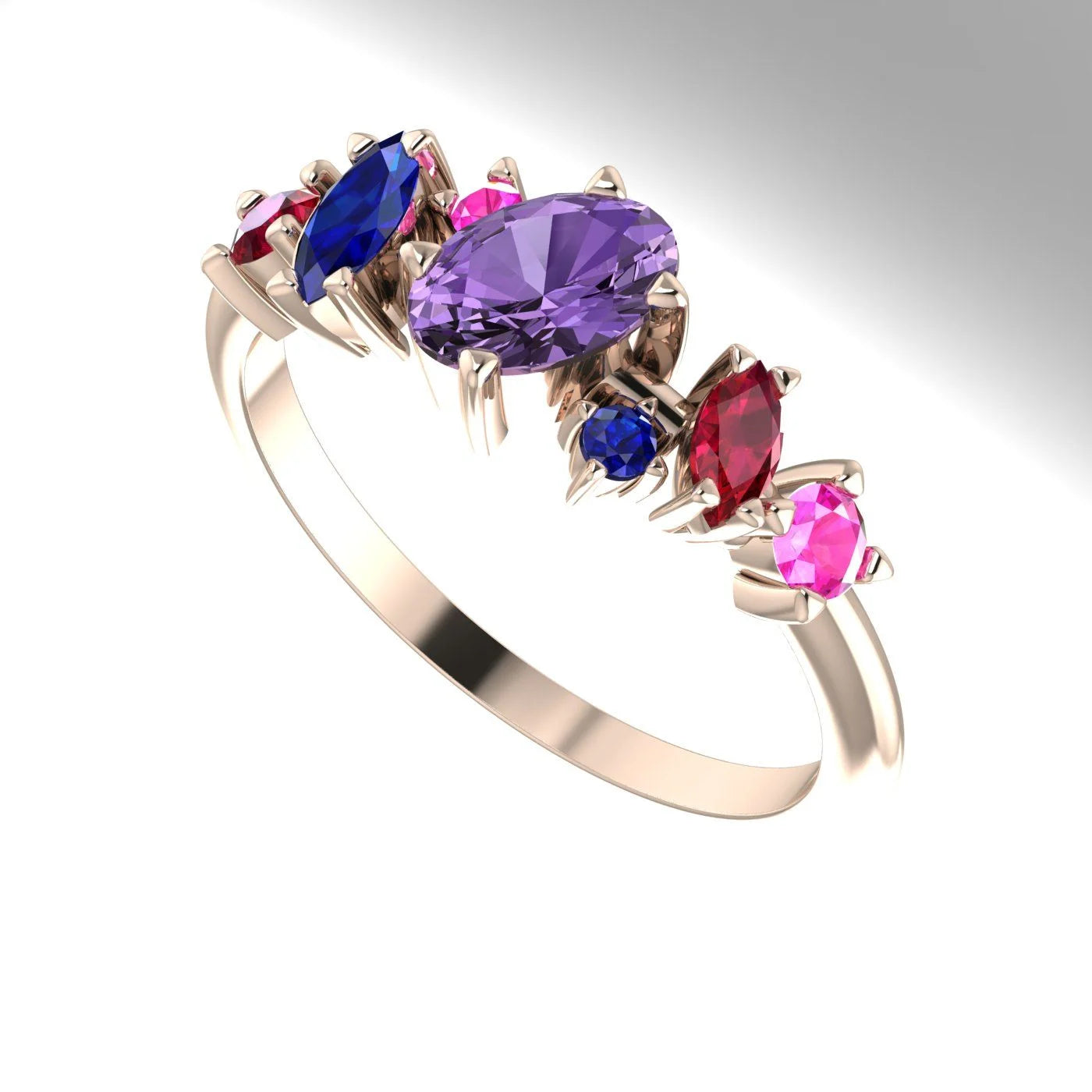 An angled view of the Atlantis Paradise ring highlighting the diverse colours of the sapphire and ruby cluster.