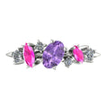 Top view of the 18ct white gold Atlantis Paradise ring featuring an asymmetrical cluster of violet and pink sapphires with diamonds.