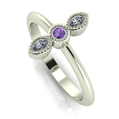 Angled perspective of the violet sapphire and diamond trilogy ring, showing the intricate beaded detailing around the three-stone setting.