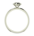 Angled perspective of a solid silver rock solitaire ring with geometric facets.