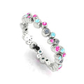 Front three-quarter studio view of the white gold bubble band, highlighting the fluid, organic arrangement of flush-set diamonds and pastel gemstones.