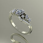 Side profile of the white gold Atlantis Storm ring, showcasing the organic wave setting and diamond arrangement.