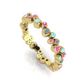 Front three-quarter studio view of the yellow gold bubble band, highlighting the modern, quirky arrangement of diamonds and pastel gemstones.