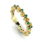 Front three-quarter studio view of the yellow gold bubble eternity band, highlighting the fluid, contemporary layout of the alternating precious coloured gemstones.