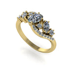 Side profile view of the yellow gold Atlantis Storm ring, showcasing the fluid, layered setting and diamond arrangement.