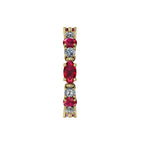 Model wearing the yellow gold Ruby and Diamond Allsorts ring, highlighting the bold colour contrast and artisan craftsmanship of this London-made piece.
